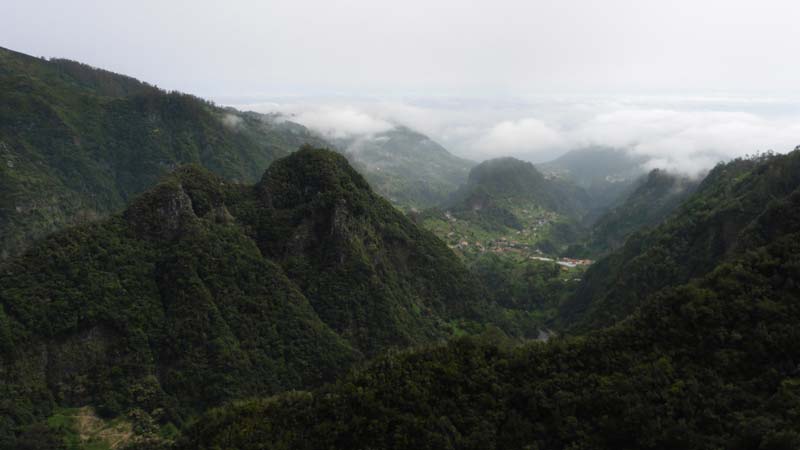 View of the Forested Mountains and Low Clouds